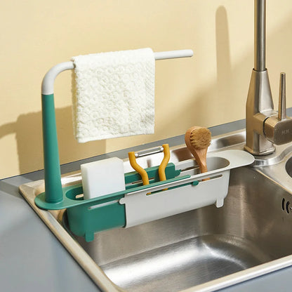 Telescopic sink organizer shelf with drainer basket for kitchen storage, dish drying, and space-saving countertop organization.
