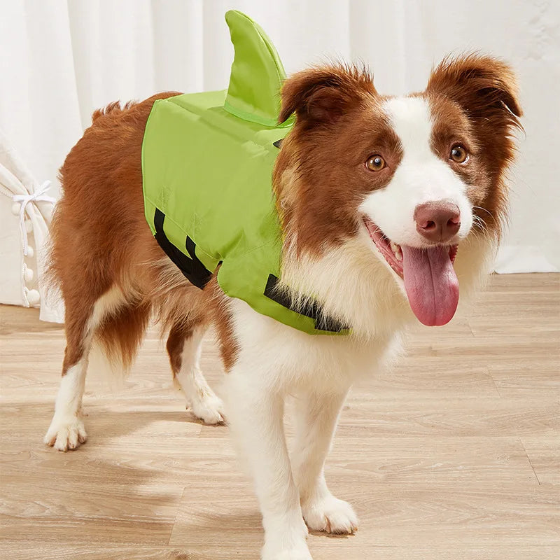 Shark Fin Dog Life Jacket with buoyant flotation support, adjustable straps, and rescue handle for safe swimming and water activities for pets.