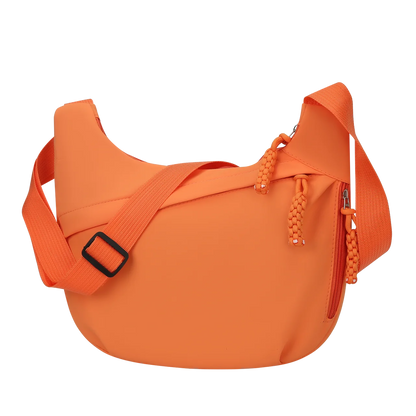 Orange shoulder bag with a strap on a white background