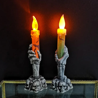 Halloween skeleton hand candle holders with candles for spooky gothic party and home decor