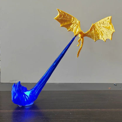 Blue and gold dragon figurine on a plain background