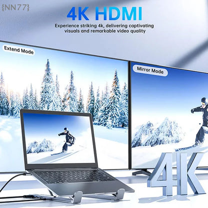Laptop with dual monitors displaying snowy landscape scenes, emphasizing 4K HDMI technology.