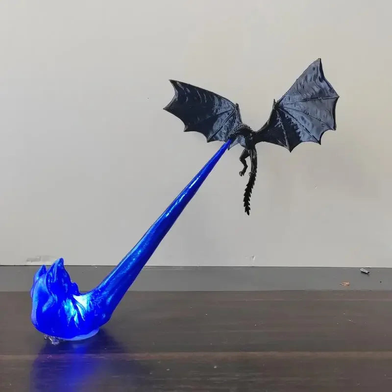 Blue dragon-shaped object on a wooden surface with a plain background