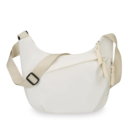 White shoulder bag with beige strap on a white background