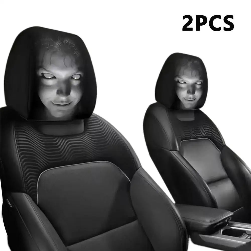Two black car headrest covers with a person's face illuminated on a white background.