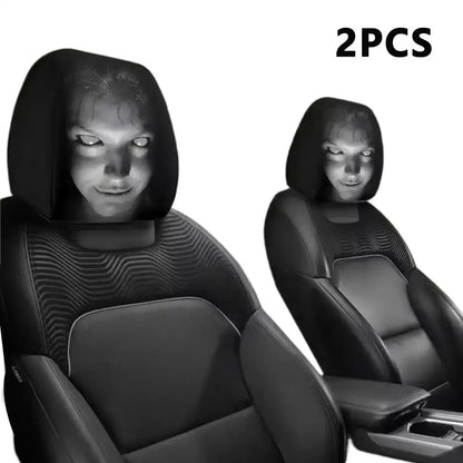 Two black car headrest covers with a person's face illuminated on a white background.