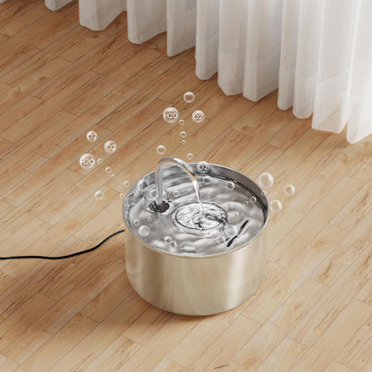 Stainless steel pet water fountain on a wooden floor with white curtains in the background