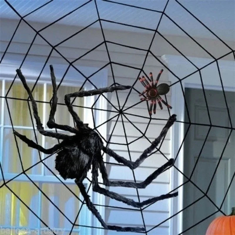 Halloween spider web decoration with large spiders on a window.