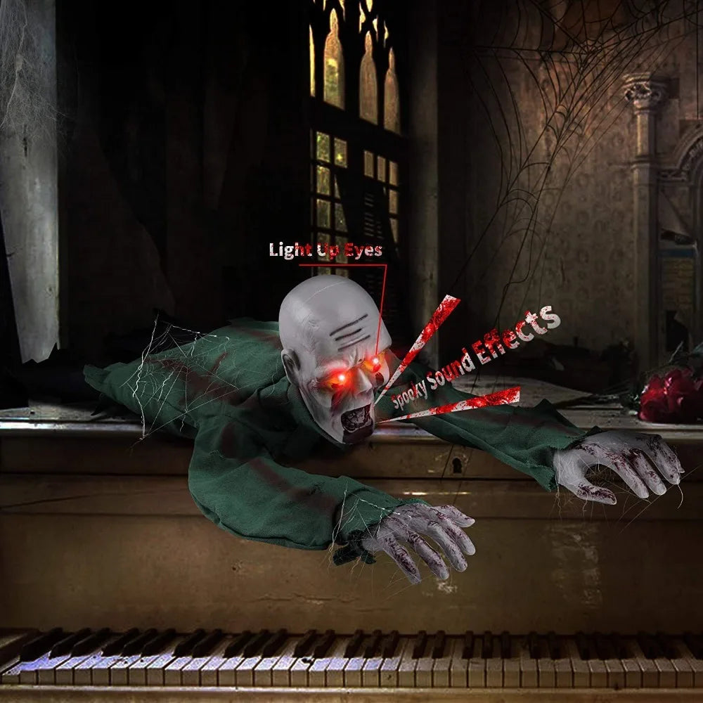 A creepy Halloween decoration of a zombie-like skull figure with glowing red eyes and bloody accents, posed on top of a vintage piano in a dark, gothic room setting.