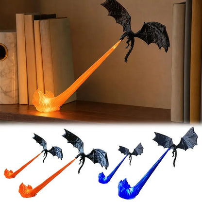 A dragon-shaped lamp with black wings and a flame-shaped base, shown lit in orange on a shelf above, plus smaller views below showing the lamp in orange, blue, and white flame colors.