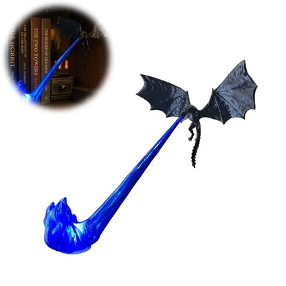A black dragon figurine with spread wings holding a glowing blue staff or beam, shown on a white background with a circular inset demonstrating its use in a dark setting.