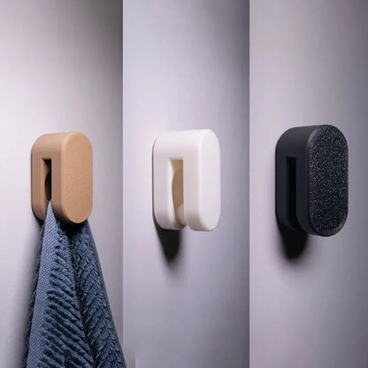 Automatic locking towel hook holding a towel securely on a wall-mounted holder.