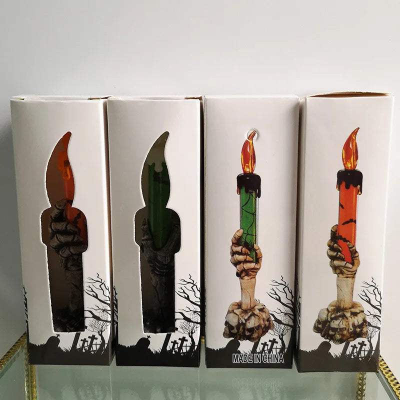 Four boxes with Halloween-themed illustrations of candles and hands holding them on a white background.